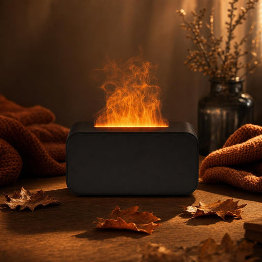 Llamora, difusor de aroma con efecto llama, centrado sobre mesa de madera en ambiente de otoño